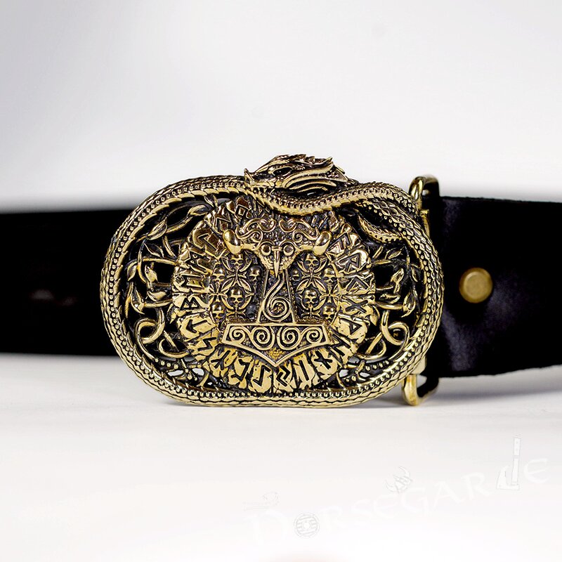 Decorative Viking belt buckle with intricate design on a black belt against a white background