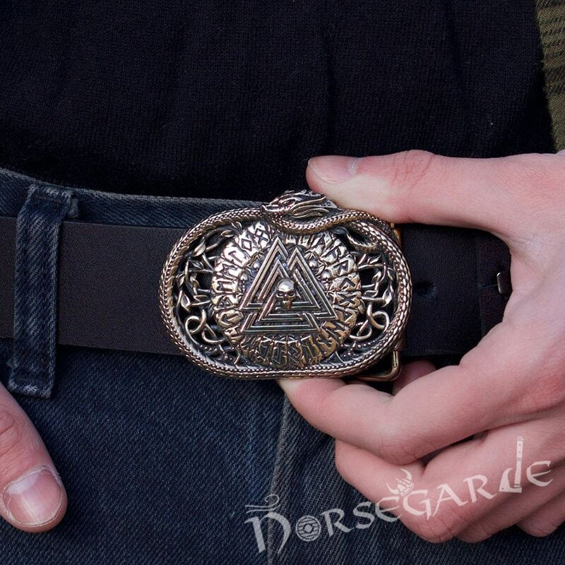 Close-up of a person wearing a belt with a Viking decorative buckle, featuring the brand 'Norsegarde'.